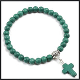 Green natural stone beaded bracelet with a cross pendant, ideal for religious and everyday wear.