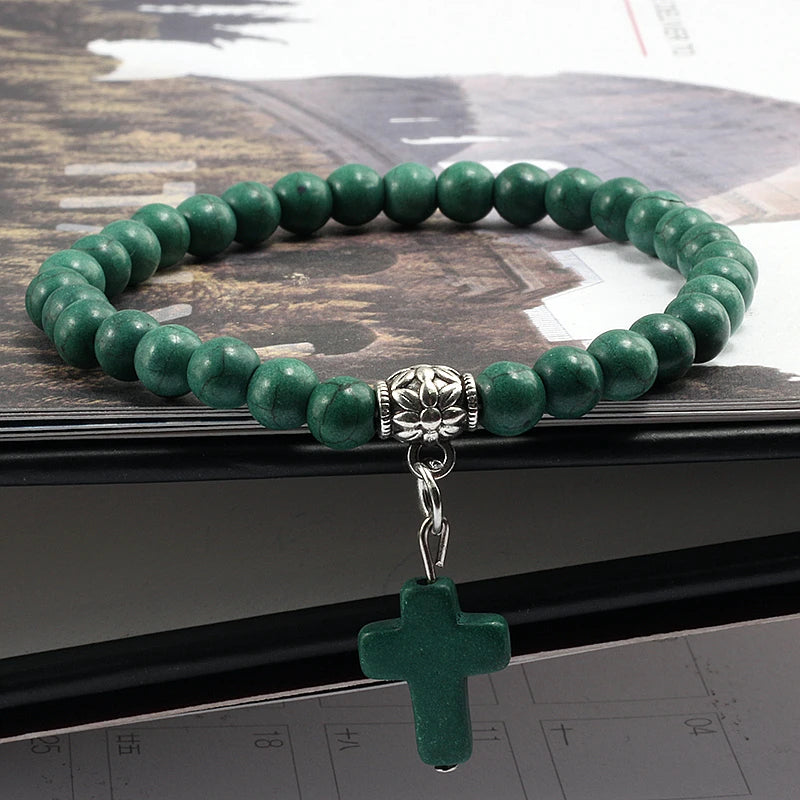 Green natural stone beaded bracelet with a cross pendant, ideal for religious and everyday wear.