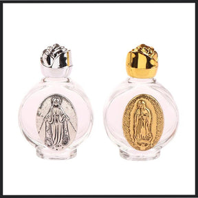 Glass holy water bottle with a gold or silver Our Lady of Guadalupe medallion and a rose-shaped twist-on lid. Use for: Baptism, First Communion, Holy Communion, Confirmation, Blessing of Homes, Blessing of Objects, Personal Devotion, Sacramentals, Church Entrances, Funerals, Easter Vigil, Special Feast Days, Easter, Weddings, Christmas.