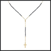 Gold-plated stainless steel rosary necklace featuring dark beads, a Y-shaped chain leading to a crucifix pendant, offering a sophisticated and spiritual design.