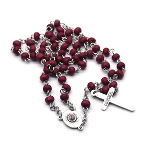 Rustic Wooden Rosary with Black Beads and a Traditional Crucifix Pendant