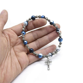 Stylish blue and silver bead bracelet featuring a small alloy cross pendant, perfect for spiritual expression and daily wear.