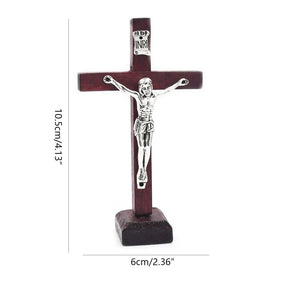 Wine red wooden crucifix with silver-tone Jesus figure, standing on a stable base.